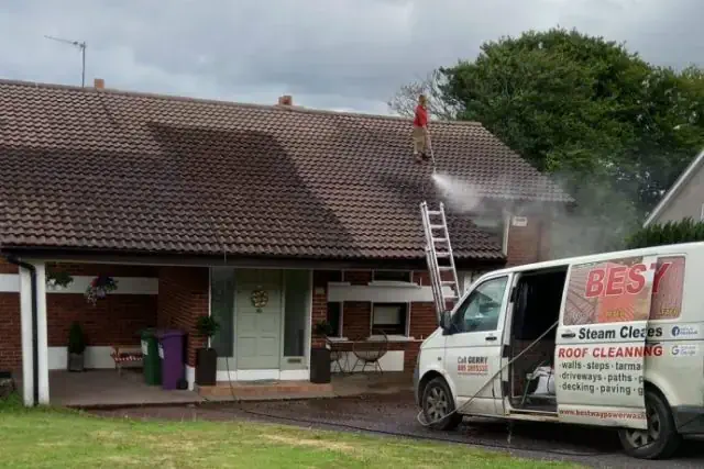 Professional roof cleaning being carried out on a Cork roof